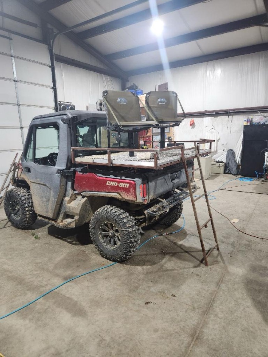 Can-Am UTV with custom-fabricated rack and rooftop tent platform in the shop