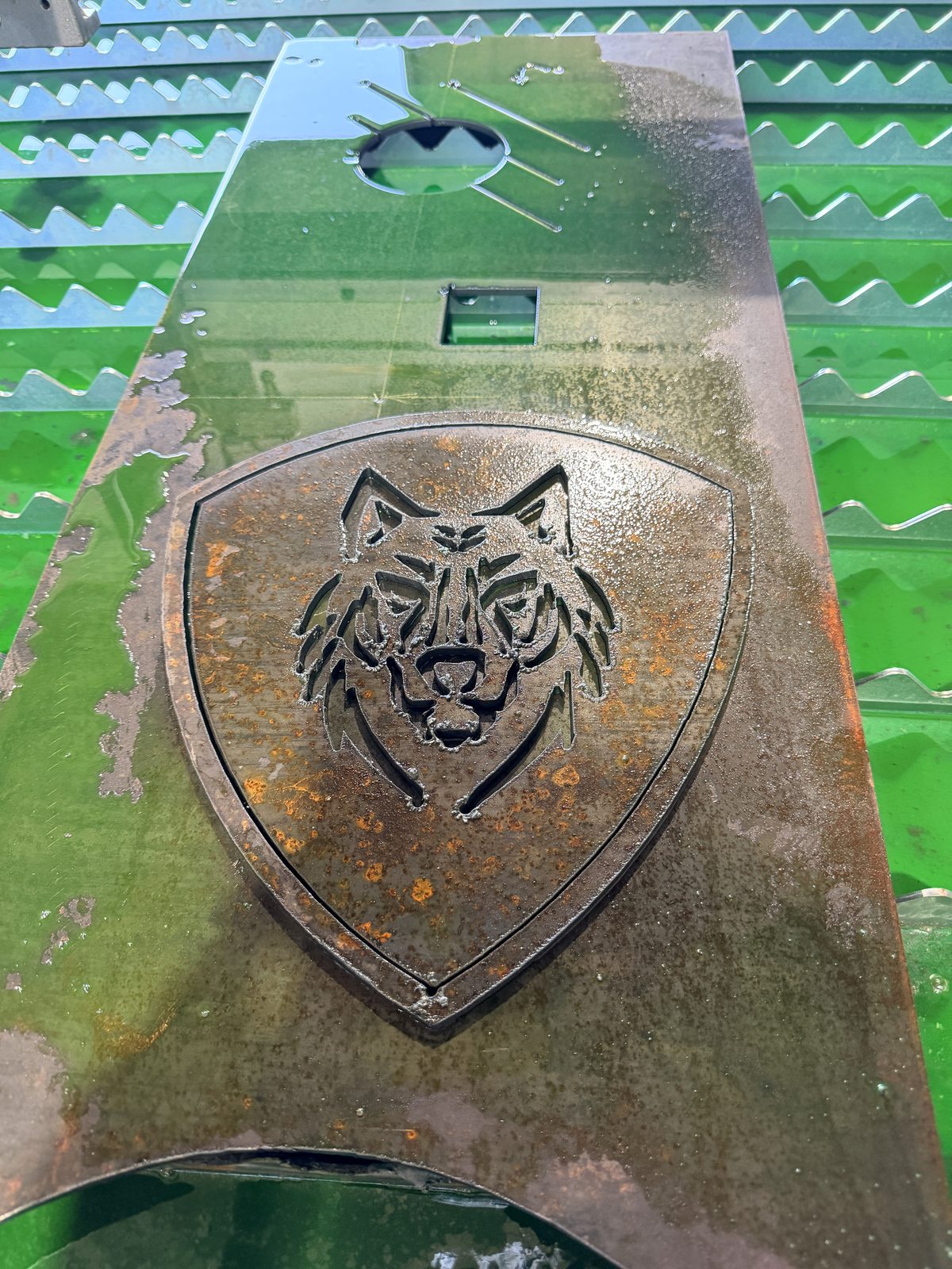 CNC cut Iron Wolfe wolf logo in steel plate